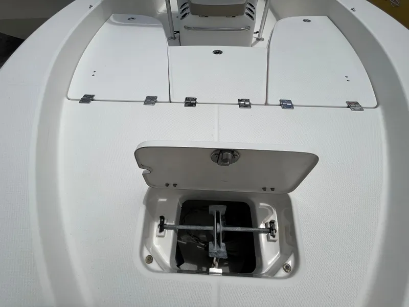 Slide: The Image of 2016 Robalo 206 Cayman boat deck with open anchor compartment. - 26