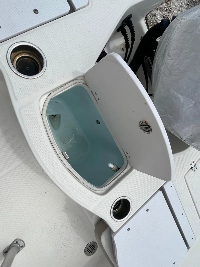 Slide: The Image of Open storage compartment on a 2016 Robalo 206 Cayman boat deck. - 27
