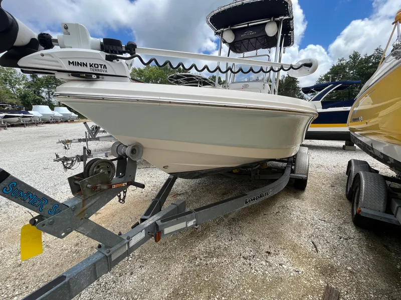 Slide: The Image of 2016 Robalo 206 Cayman boat on trailer with Minn Kota Terrova motor, parked outdoors. - 3