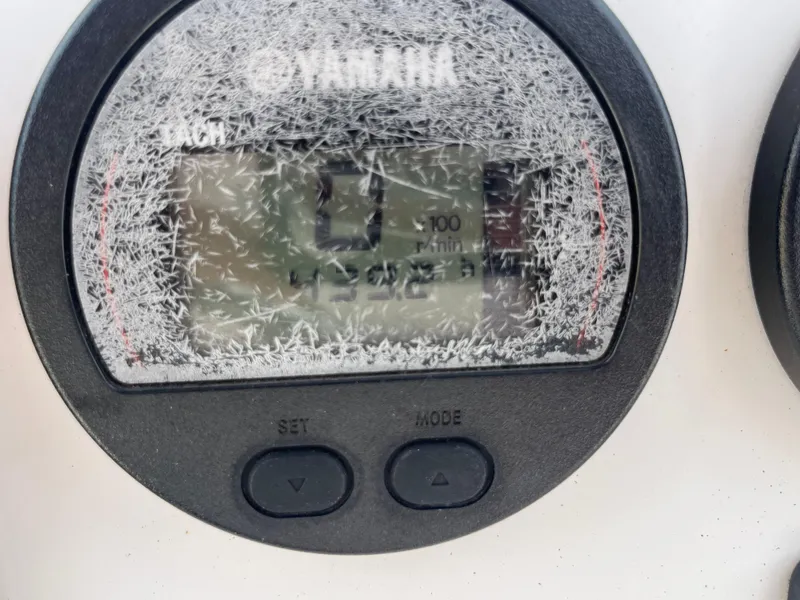 Slide: The Image of Close-up of a weathered Yamaha tachometer on a 2016 Robalo 206 Cayman boat. - 38