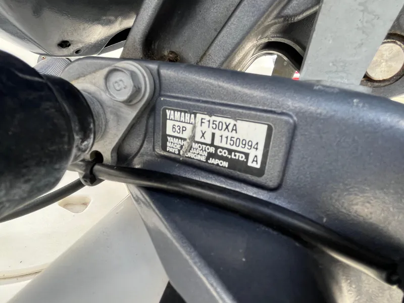 Slide: The Image of Close-up of Yamaha F150XA engine label on a 2016 Robalo 206 Cayman boat. - 39