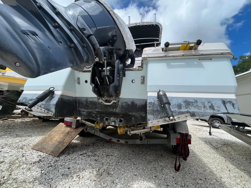 Slide: The Image of 2016 Robalo 206 Cayman boat on trailer, showing outboard motor and hull details. - 8