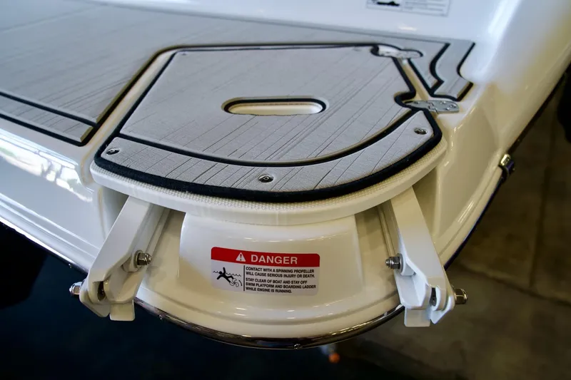Slide: The Image of 2026 Four Winns H1 boat swim platform with safety warning label. - 12