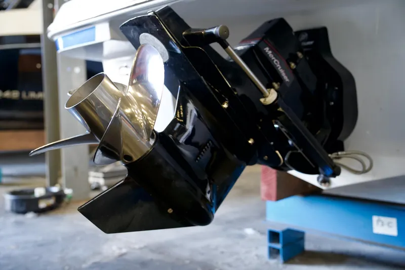 Slide: The Image of 2026 Four Winns H1 boat propeller and drive system in a workshop setting. - 13