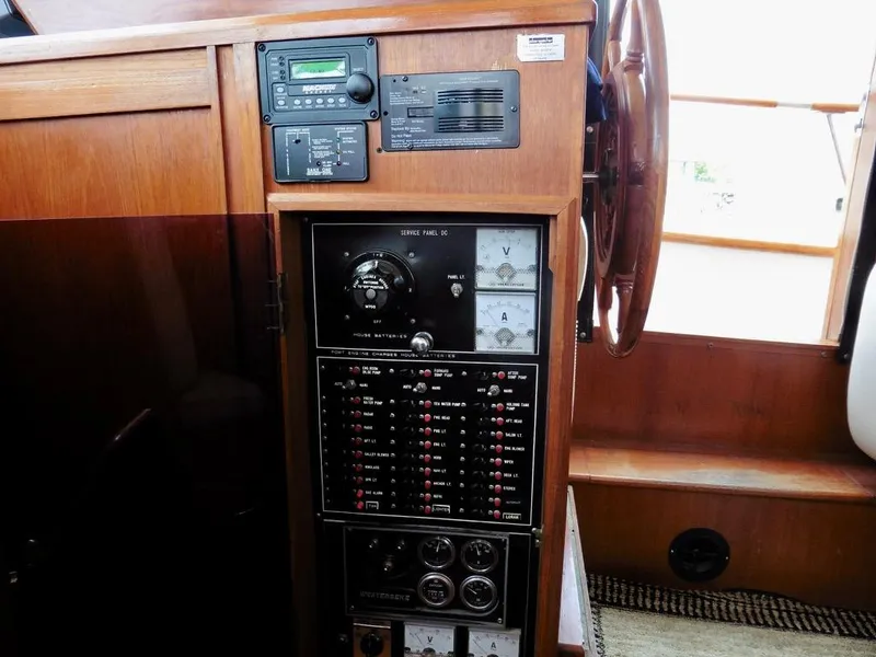 Slide: The Image of Control panel of 1984 Ocean Alexander 38 Double Cabin yacht, featuring gauges and switches. - 11