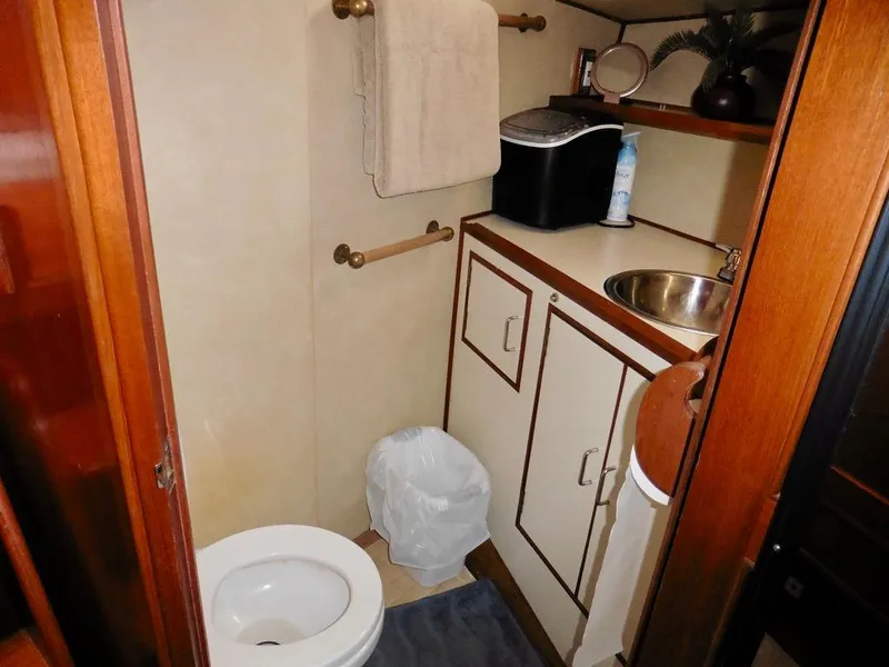 Slide: The Image of Bathroom in 1984 Ocean Alexander 38 Double Cabin yacht, featuring sink and toilet. - 12