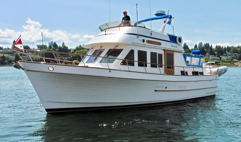 Slide: The Image of 1984 Ocean Alexander 38 Double Cabin yacht on calm water, sunny day. - 3