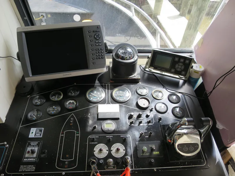 Slide: The Image of Control panel of a 1998 Monticello River Yacht Houseboat with navigation instruments. - 11