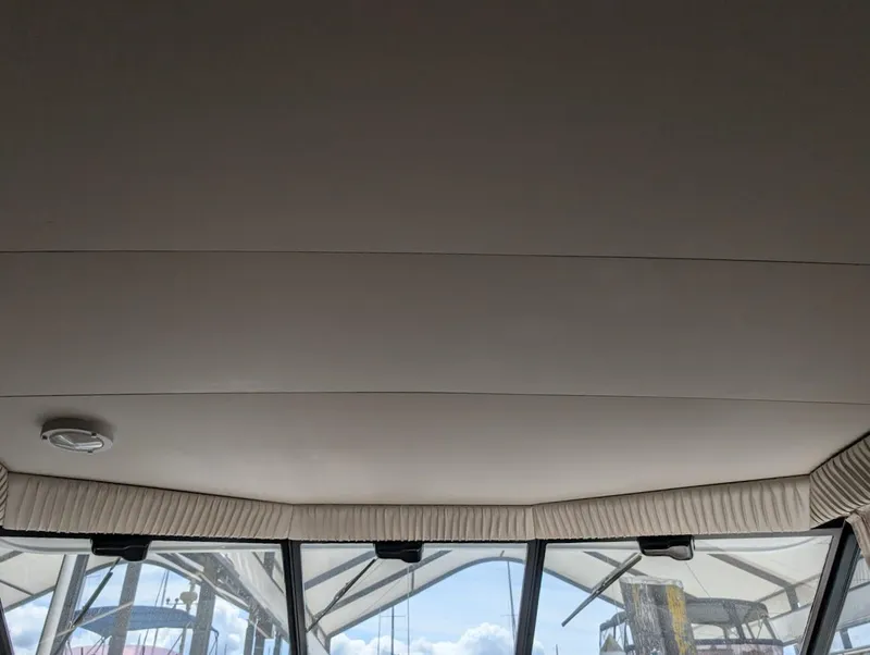 Slide: The Image of Interior view of 1991 Carver 430 Cockpit Motor Yacht ceiling and windows. - 31