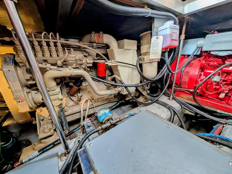 Slide: The Image of Engine room of a 1991 Carver 430 Cockpit Motor Yacht, showcasing mechanical components. - 40