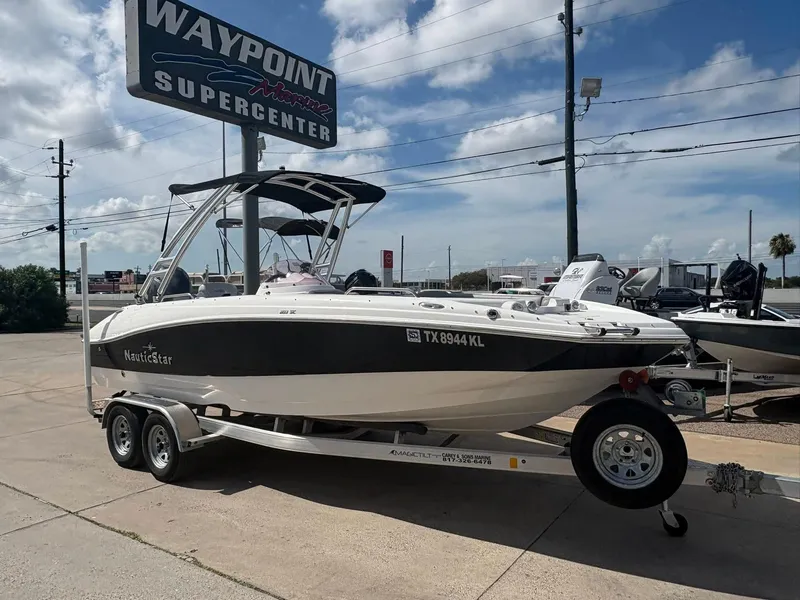 The Image of 2021 NauticStar 203 SC boat on trailer at Waypoint Marine Supercenter. - 0