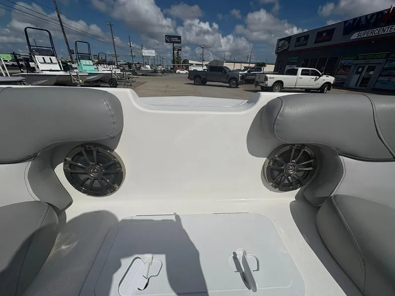 Slide: The Image of Interior view of 2021 NauticStar 203 SC boat with gray seating and speakers. - 12