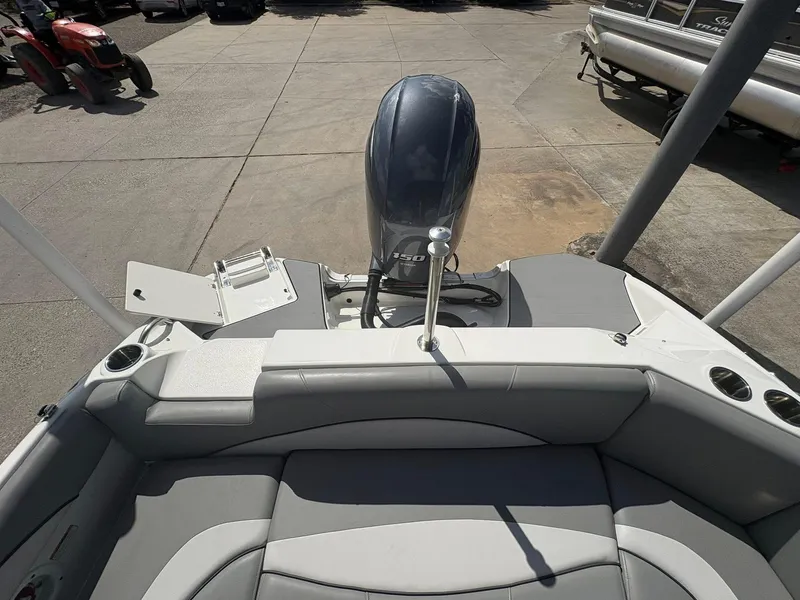 Slide: The Image of 2021 NauticStar 203 SC boat interior with outboard motor and seating area. - 8