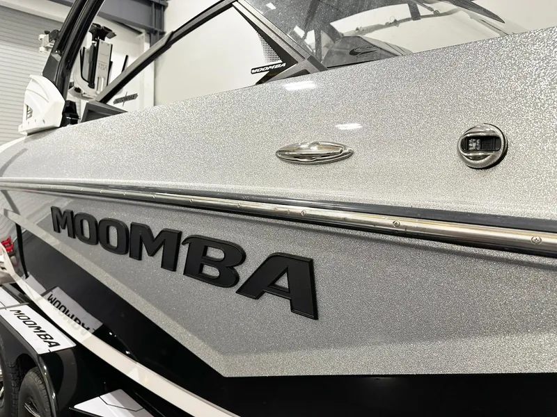 Slide: The Image of 2021 Moomba Kaiyen boat with metallic finish and bold logo. - 10