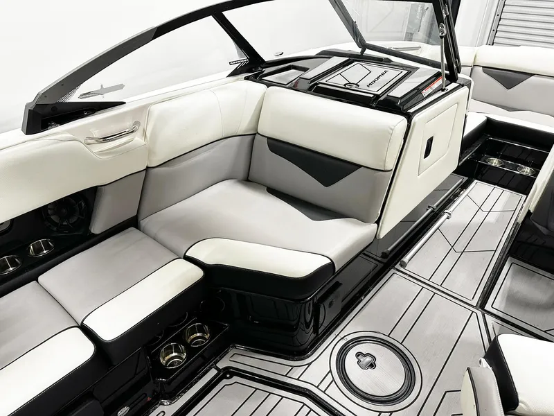 Slide: The Image of 2021 Moomba Kaiyen boat interior with sleek white and black seating and modern design. - 8