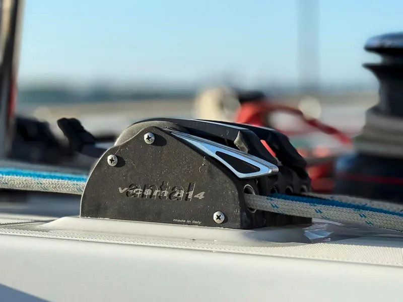 Slide: The Image of Close-up of 2017 Lagoon 42 sailboat rigging against a sunlit sea background. - 12