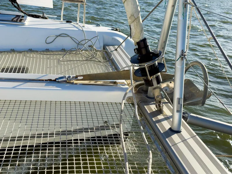 Slide: The Image of 2017 Lagoon 42 catamaran interior view at marina, showcasing helm and seating area. - 16