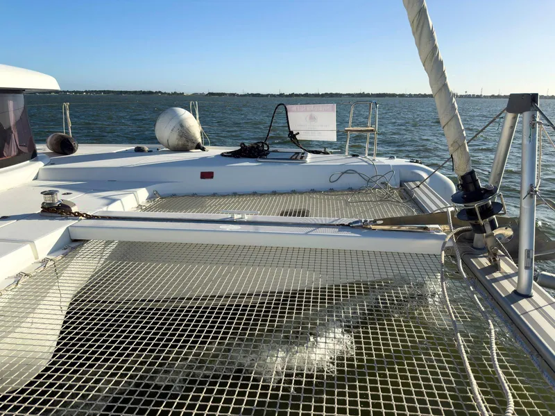 Slide: The Image of Engine compartment of a 2017 Lagoon 42 catamaran, featuring mechanical components and storage. - 21