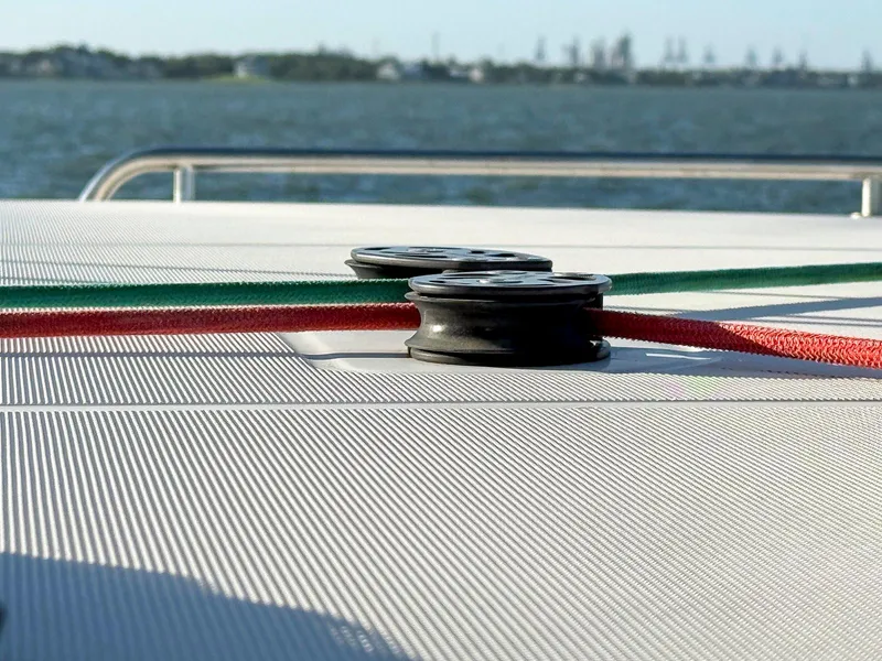 Slide: The Image of Wooden storage compartment on a 2017 Lagoon 42, containing scattered debris. - 26