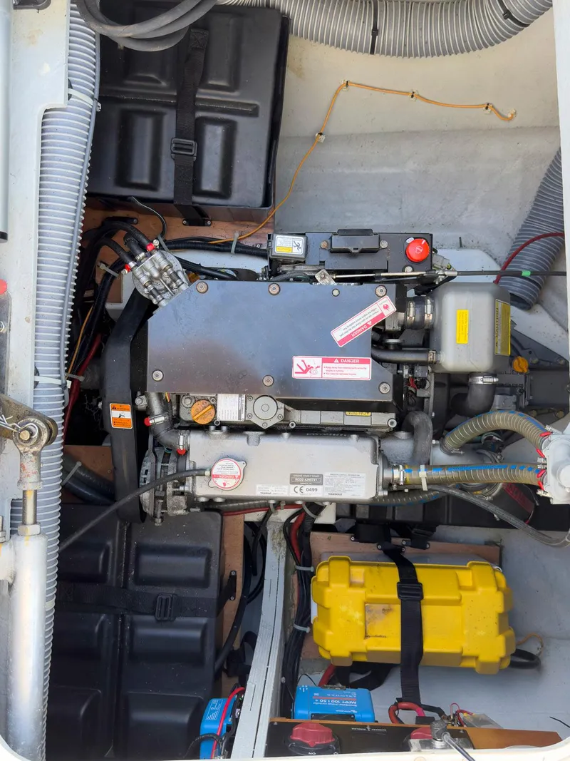 Slide: The Image of Access panel showing plumbing and wiring inside a 2017 Lagoon 42 boat. - 27