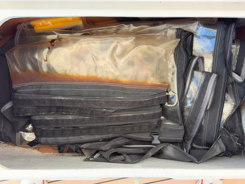 Slide: The Image of Bilge area of a 2017 Lagoon 42 catamaran, showing pipes and textured surfaces. - 29