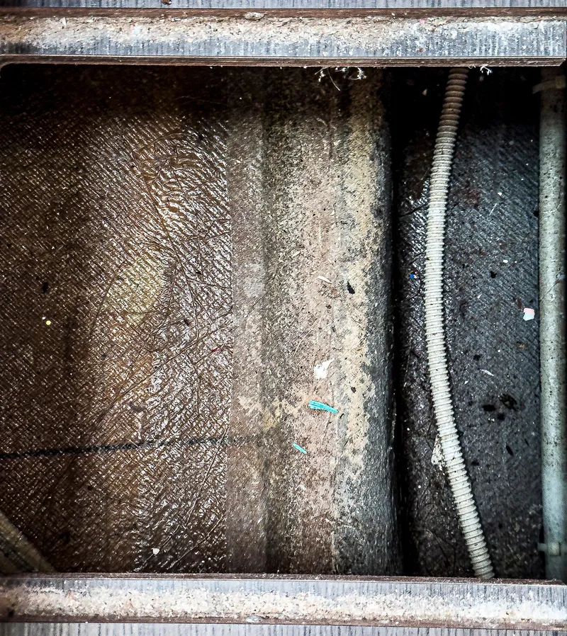 Slide: The Image of Self-contained inverter inside a 2017 Lagoon 42 yacht, under a wooden compartment. - 36