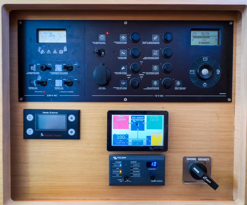 Slide: The Image of Interior compartment of a 2017 Lagoon 42 boat, showing wiring and wood paneling. - 40