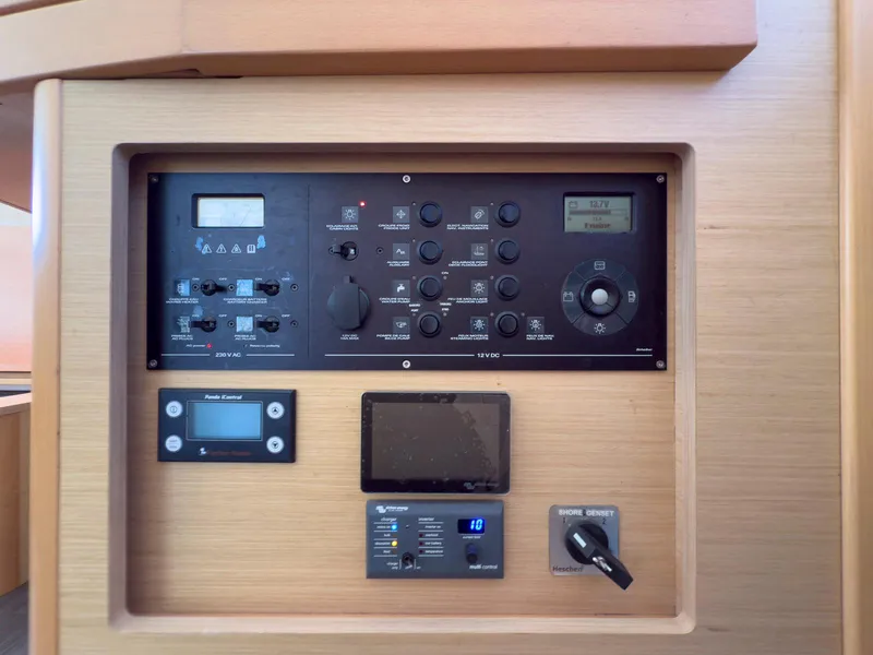 Slide: The Image of 2017 Lagoon 42 catamaran docked at marina under clear blue sky. - 49