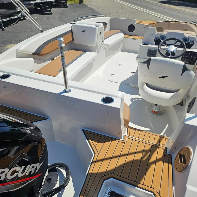Slide: The Image of 2026 Starcraft SVX 171 OB boat interior with tan seating and Mercury engine. - 14