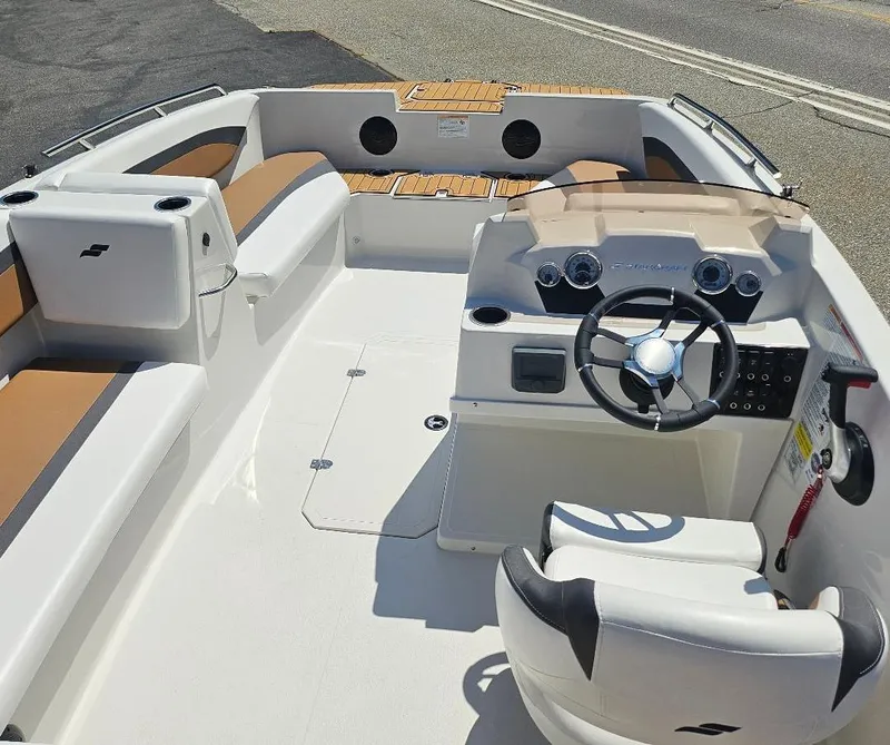 Slide: The Image of 2026 Starcraft SVX 171 OB boat interior with modern seating and steering console. - 7