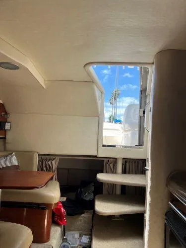Slide: The Image of Interior of 2007 Sea Ray 290 Amberjack with steps leading to deck, showcasing compact cabin design. - 6