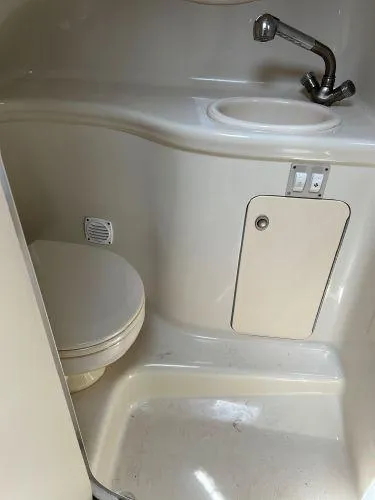 Slide: The Image of 2007 Sea Ray 290 Amberjack bathroom with sink and toilet. - 9