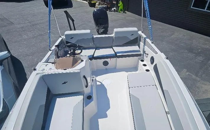 Slide: The Image of 2026 Starcraft SV 16 OB boat interior with seating and steering console. - 10