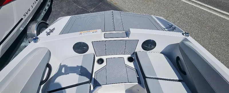 Slide: The Image of 2026 Starcraft SV 16 OB boat interior with gray seating and cup holders. - 11