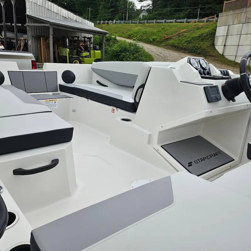 Slide: The Image of 2026 Starcraft SV 16 OB boat interior with seating and steering console. - 4