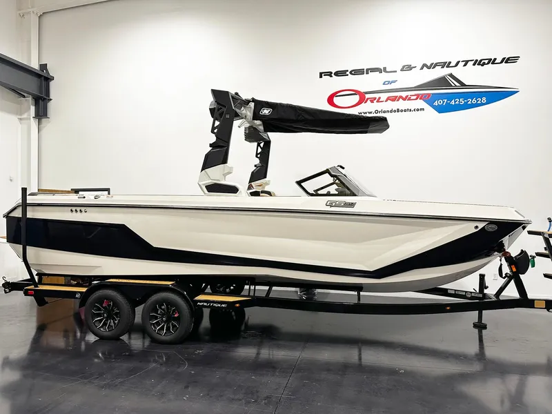 The Image of 2026 Nautique GS24 boat on trailer in showroom, Regal & Nautique of Orlando. - 1