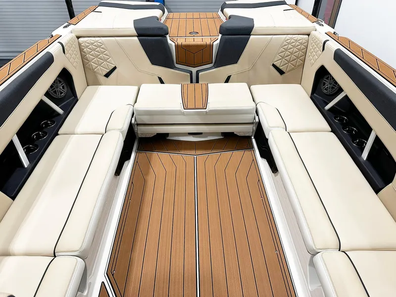 Slide: The Image of 2026 Nautique GS24 boat interior with luxurious seating and wood accents. - 4