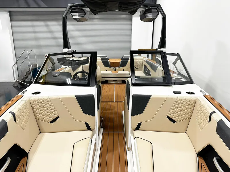 Slide: The Image of 2026 Nautique GS24 boat interior with beige and black seating, modern design. - 5