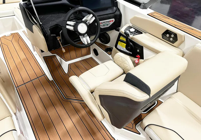 Slide: The Image of 2026 Nautique GS24 boat interior with luxurious seating and modern dashboard design. - 7
