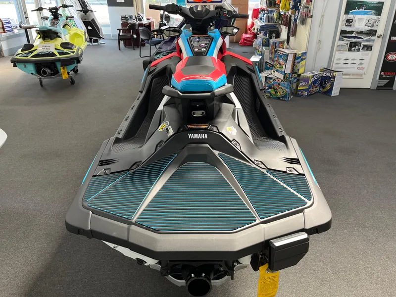 Slide: The Image of 2025 Yamaha WaveRunner JetBlaster DLX 3-Up in showroom, rear view. - 2