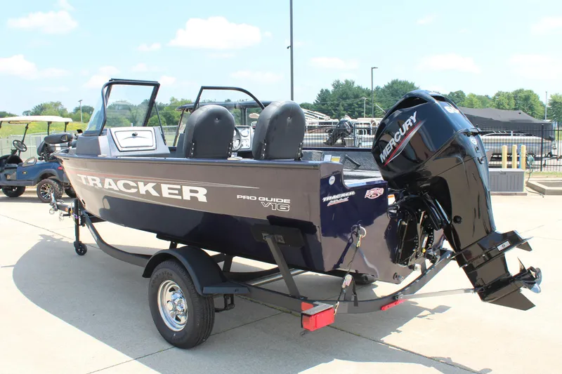 Slide: The Image of 2026 Tracker Pro Guide V-16 WT boat with Mercury engine on trailer. - 5