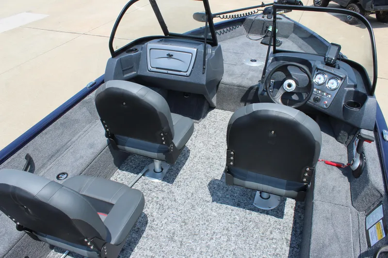Slide: The Image of 2026 Tracker Pro Guide V-16 WT boat interior with dual seats and modern dashboard. - 8