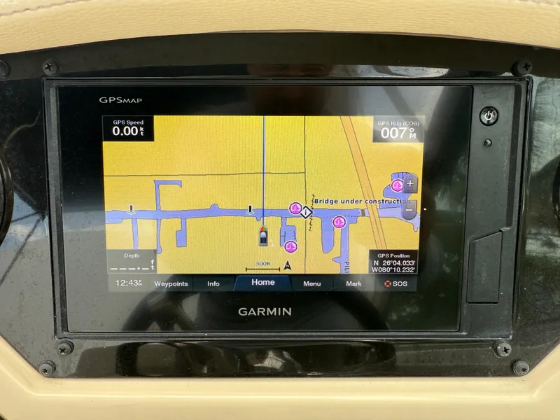 Slide: The Image of Garmin GPS display on 2019 Regal 28 Express boat, showing navigation map and coordinates. - 16