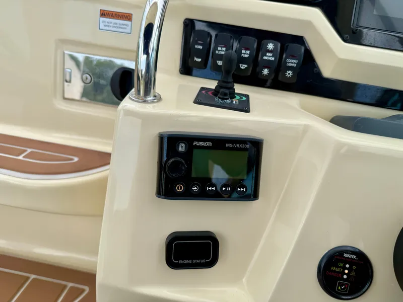 Slide: The Image of Control panel of 2019 Regal 28 Express boat with Fusion MS-NRX300 audio system. - 17