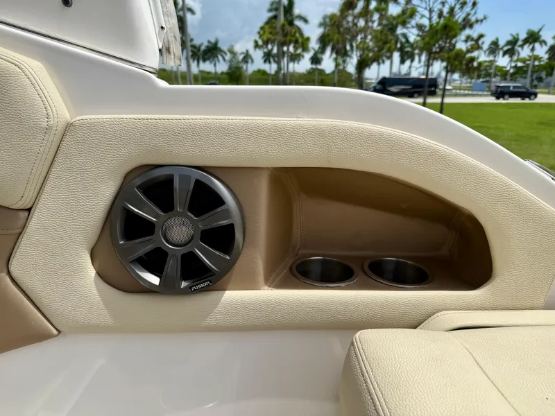Slide: The Image of 2019 Regal 28 Express boat interior with speaker and cup holders. - 21