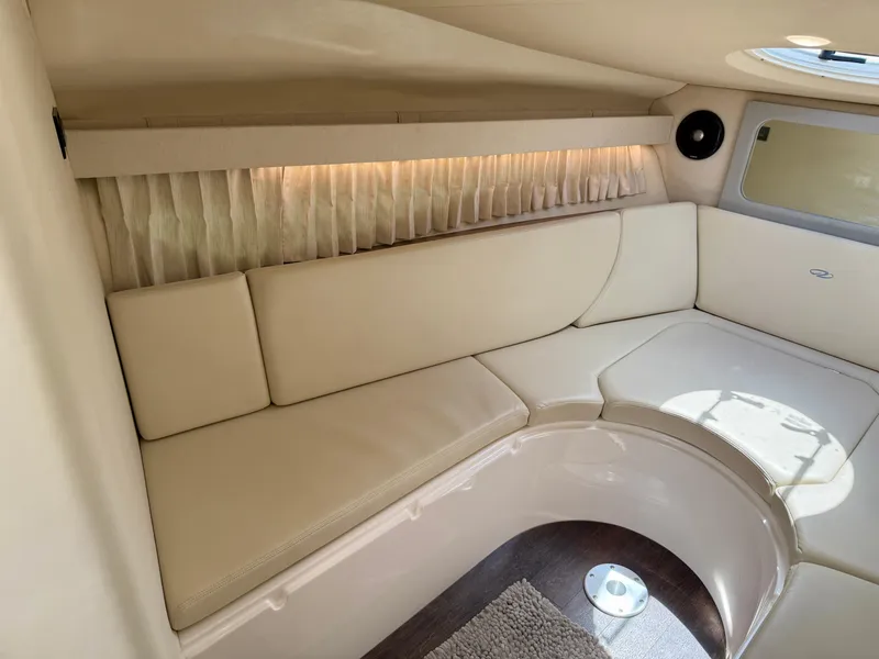 Slide: The Image of 2019 Regal 28 Express cabin interior with beige seating and elegant design. - 29