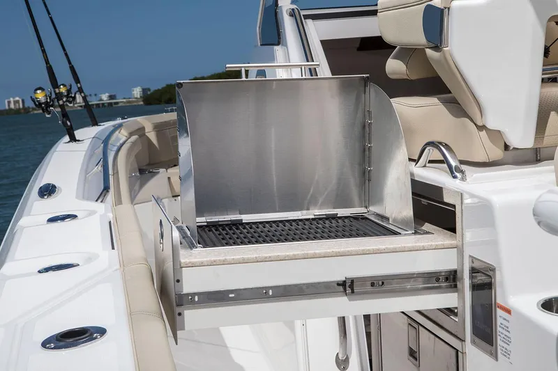 Slide: The Image of Manufacturer Provided Image: 2020 Pursuit S 368 Sport boat with built-in grill and fishing rod holders. - 11