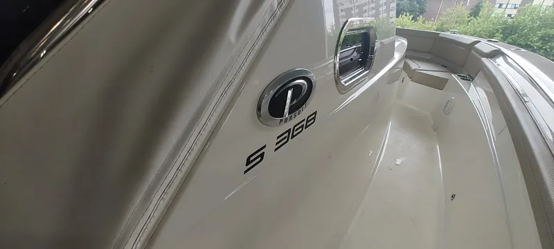 Slide: The Image of 2020 Pursuit S 368 Sport boat interior with logo and seating area. - 29