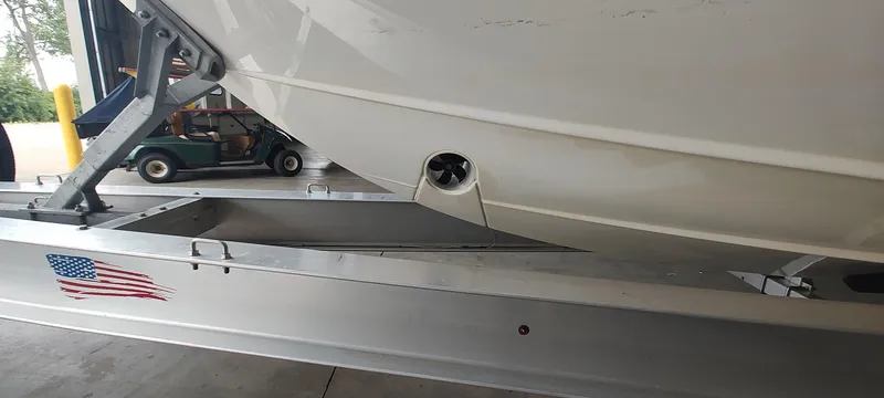 Slide: The Image of 2020 Pursuit S 368 Sport boat on trailer with American flag decal. - 5