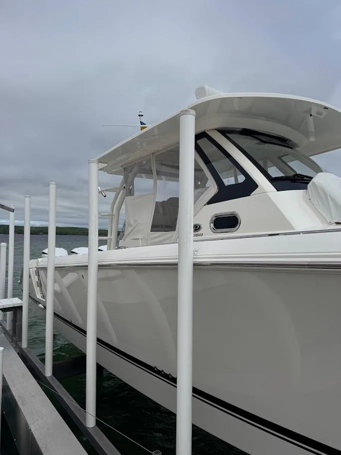 Slide: The Image of 2020 Pursuit S 368 Sport boat docked on a cloudy day. - 7